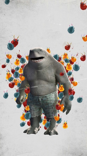 King Shark from The Suicide Squad surrounded by colorful creatures