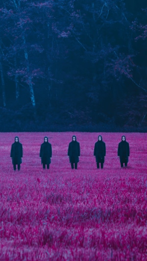 Five figures in black robes in a pink field