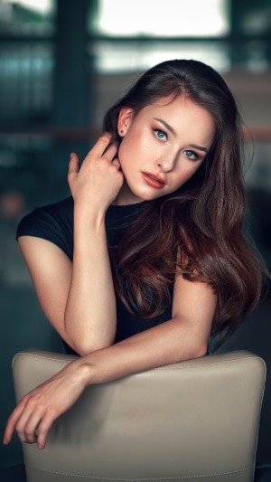 Brunette model with blue eyes posing