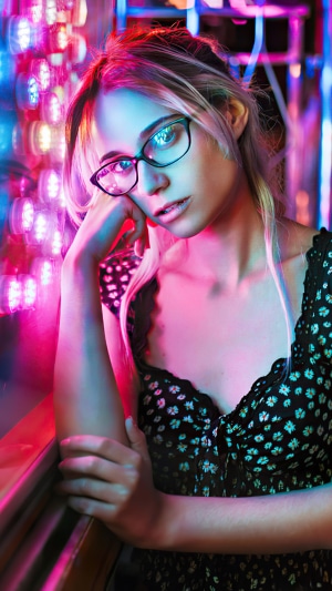 Woman with glasses in neon lights