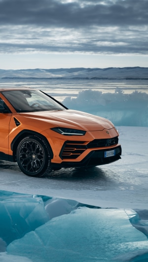 Orange Lamborghini Urus on Ice