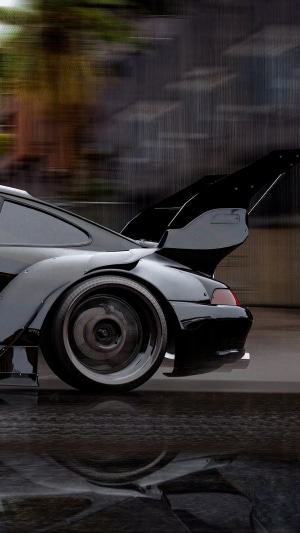 Black Porsche 911 with large rear spoiler 4K