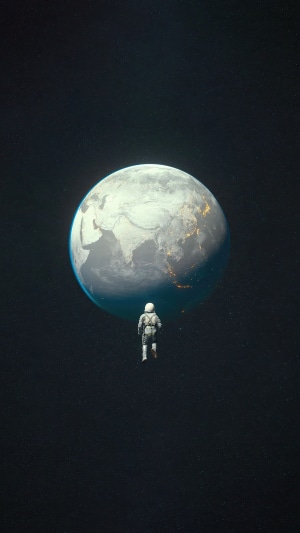 Astronaut floating in space near Earth