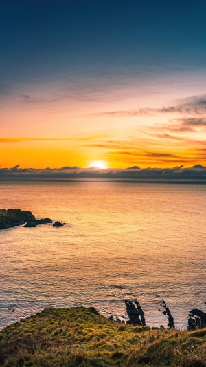 Sunrise over the sea and coast in Scotland 4K