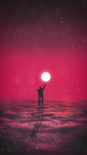 Silhouette reaching for the moon from clouds