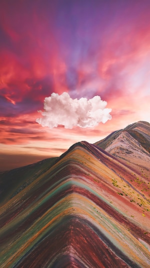 Rainbow mountains with colorful clouds at sunset 4K