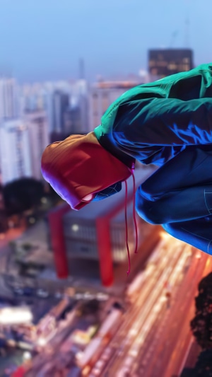 Spider-Man from Marvel Comics on a rooftop at night