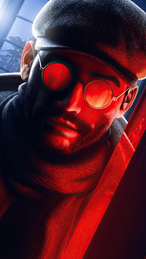 Man with glasses and beret holding a sword