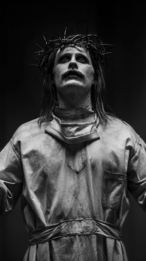 Joker from DC Comics wearing a crown of thorns