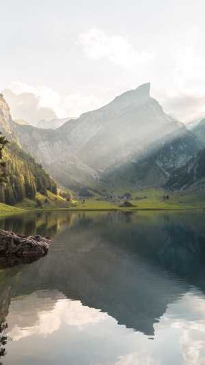 Mountain lake with sunbeams in Switzerland 4K
