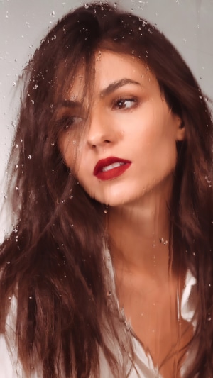 Victoria Justice with wet hair and red lipstick