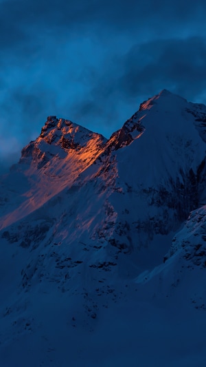 Snowy mountains at sunset 4K