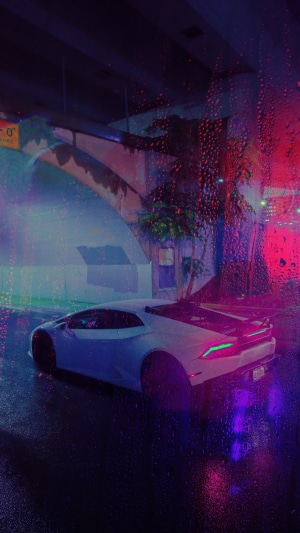 White Lamborghini on a Wet Street at Night