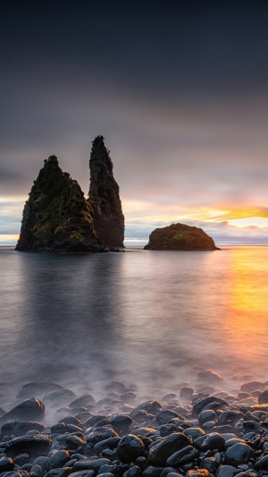 Rocky beach at sunset with sea stacks