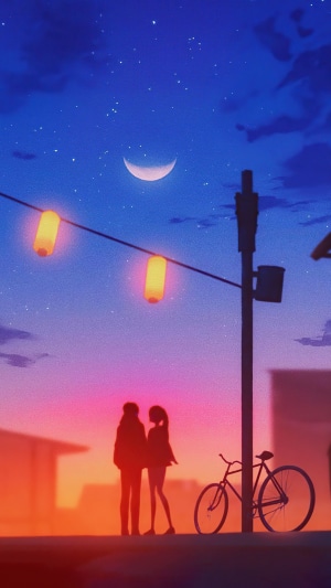 Couple under crescent moon with lanterns
