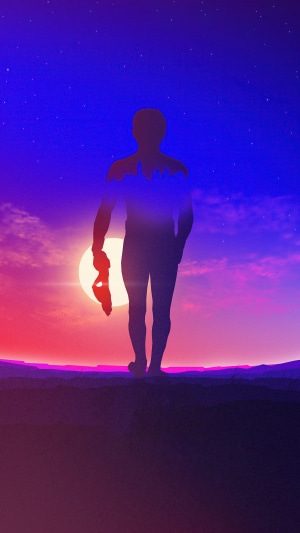 Silhouette of a man with city skyline inside against sunset