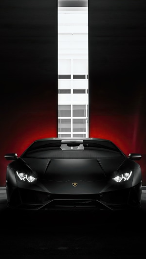 Black Lamborghini Huracan in a garage