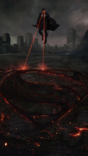 Superman using heat vision in a destroyed city