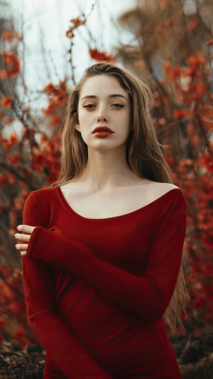 Model in a red dress with red flowers