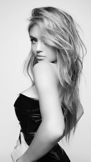 Leni Klum in black strapless dress, monochrome portrait