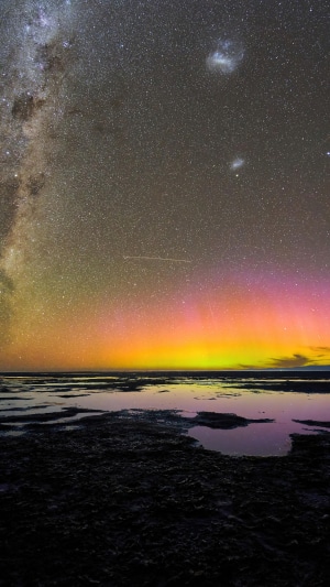 Milky Way and Aurora over water