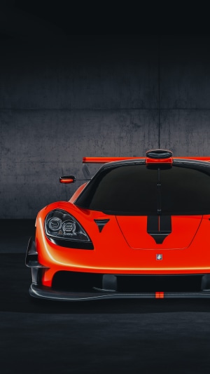 Orange McLaren Speedtail supercar with black stripes