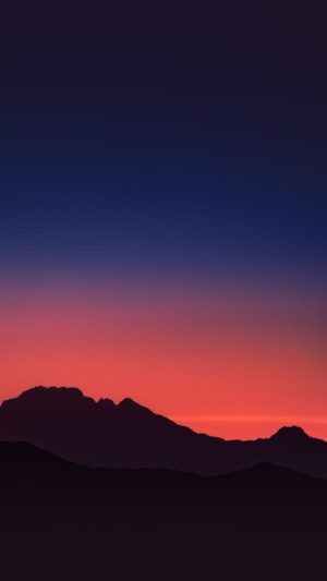 Sunset over mountain silhouettes