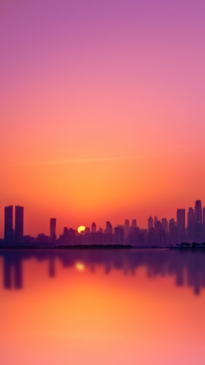 Dubai skyline at sunset over the water