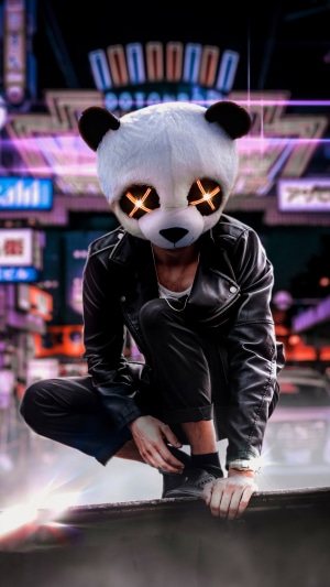 Person in Panda Mask with Glowing Eyes