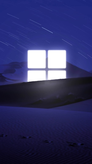 Microsoft Windows logo in a desert at night