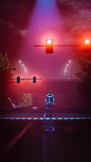 Astronaut standing at a foggy intersection with red lights