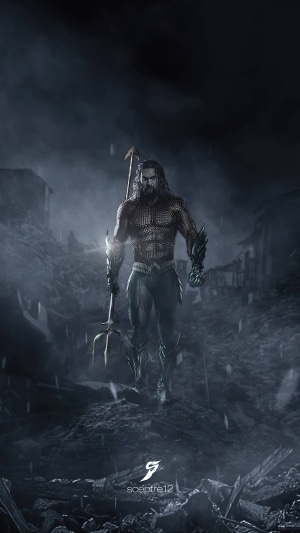 Aquaman holding a trident in a destroyed city