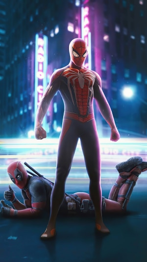 Spider-Man and Deadpool in a city at night