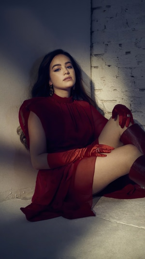 Mary Mouser in red dress and gloves