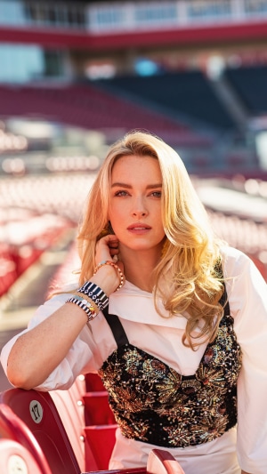 Camille Kostek in stadium seats