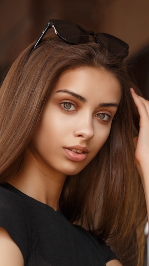 Brunette model with sunglasses on head