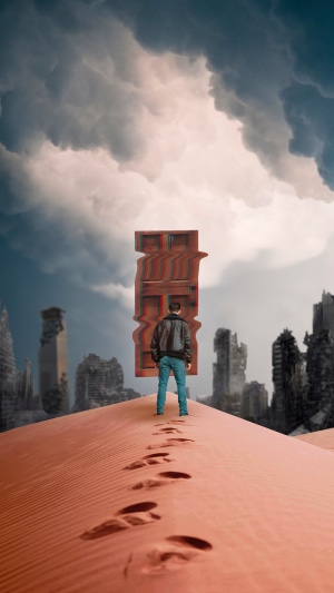 Man standing in desert before a distorted door