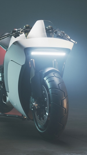 White and red futuristic motorcycle with LED headlight