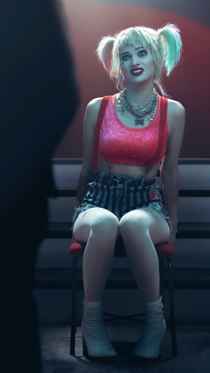 Harley Quinn sitting on a chair