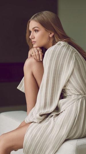 Josephine Skriver wearing a striped dress