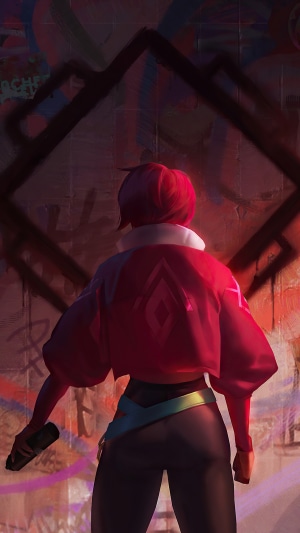 Girl with red jacket and spray can in front of graffiti wall