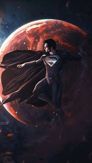 Superman in black suit with red planet background