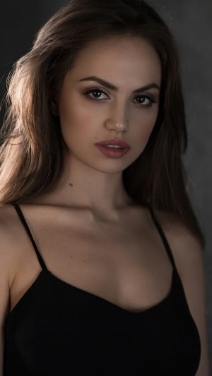 Model in black spaghetti strap top