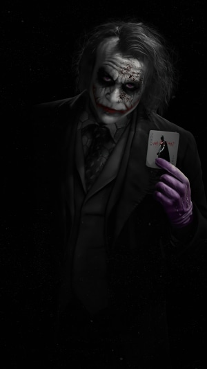 Joker holding a playing card