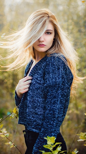 Blonde model in a blue sweater