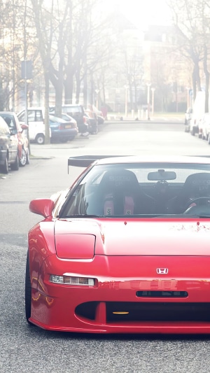 Red Honda NSX with a large rear spoiler