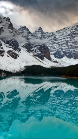 Snowy Mountains Reflecting in a Turquoise Lake in Canada 4K