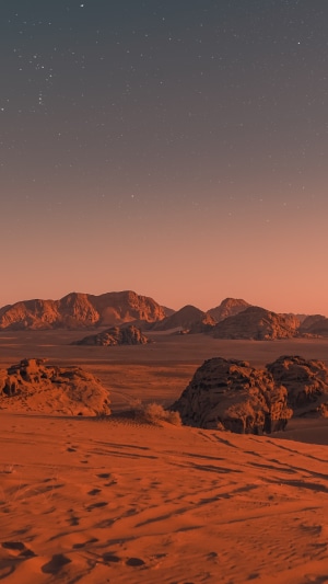 Desert landscape with mountains and stars