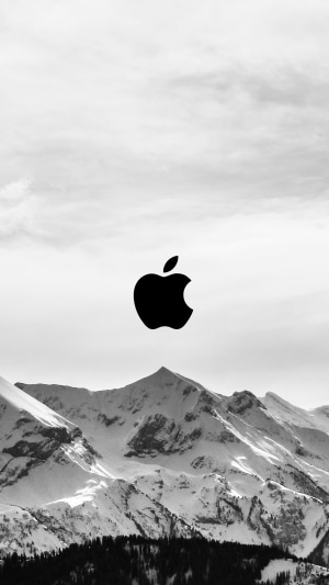 Apple logo over snowy mountains