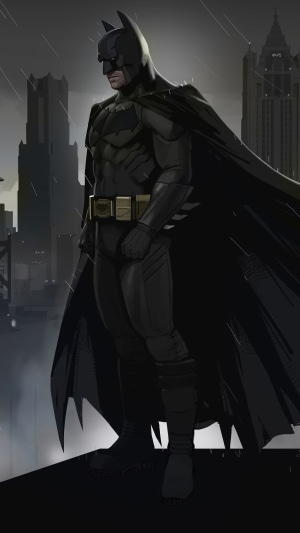 Batman standing on a rooftop in the rain